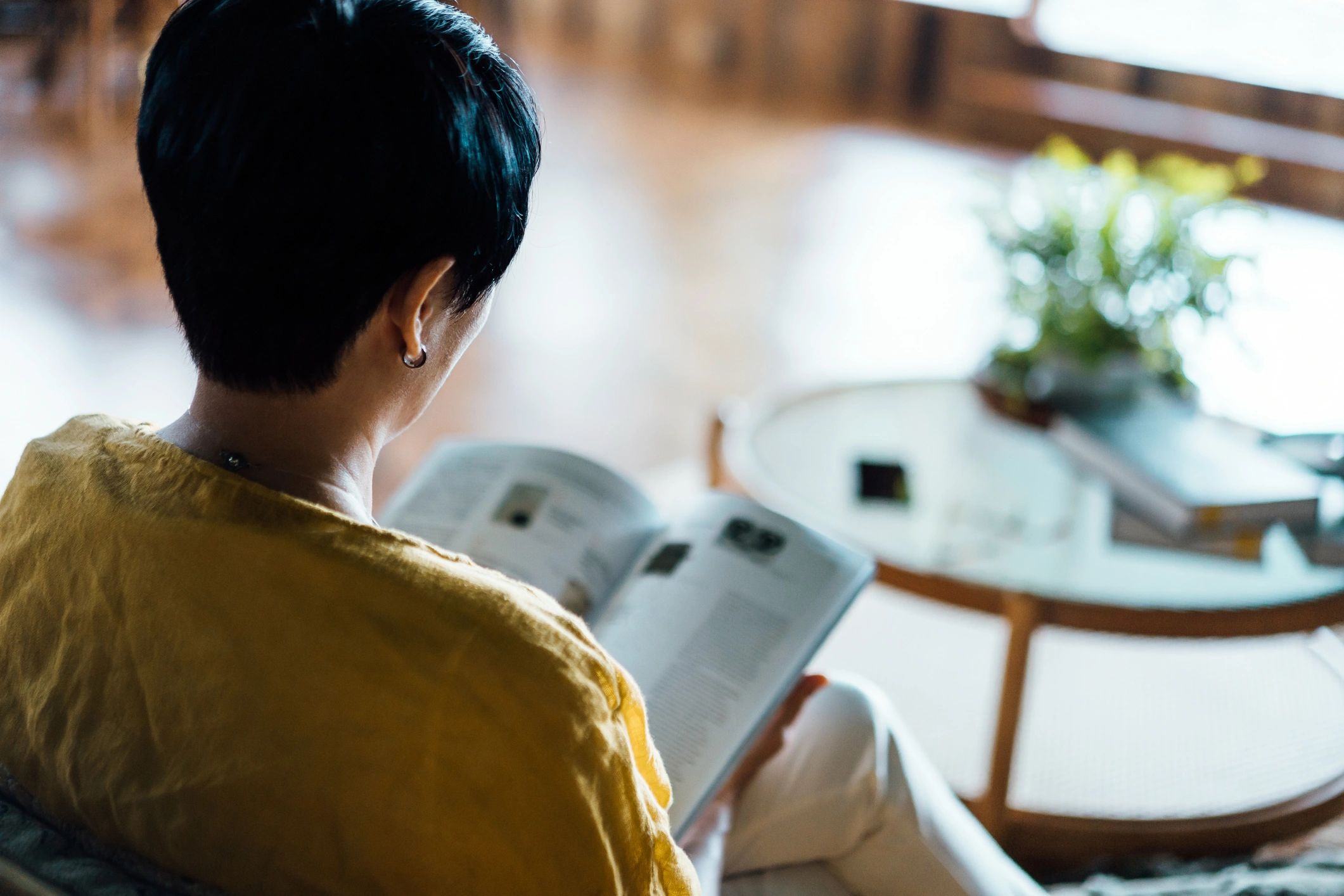 Person reading quietly at home for spiritual reflection