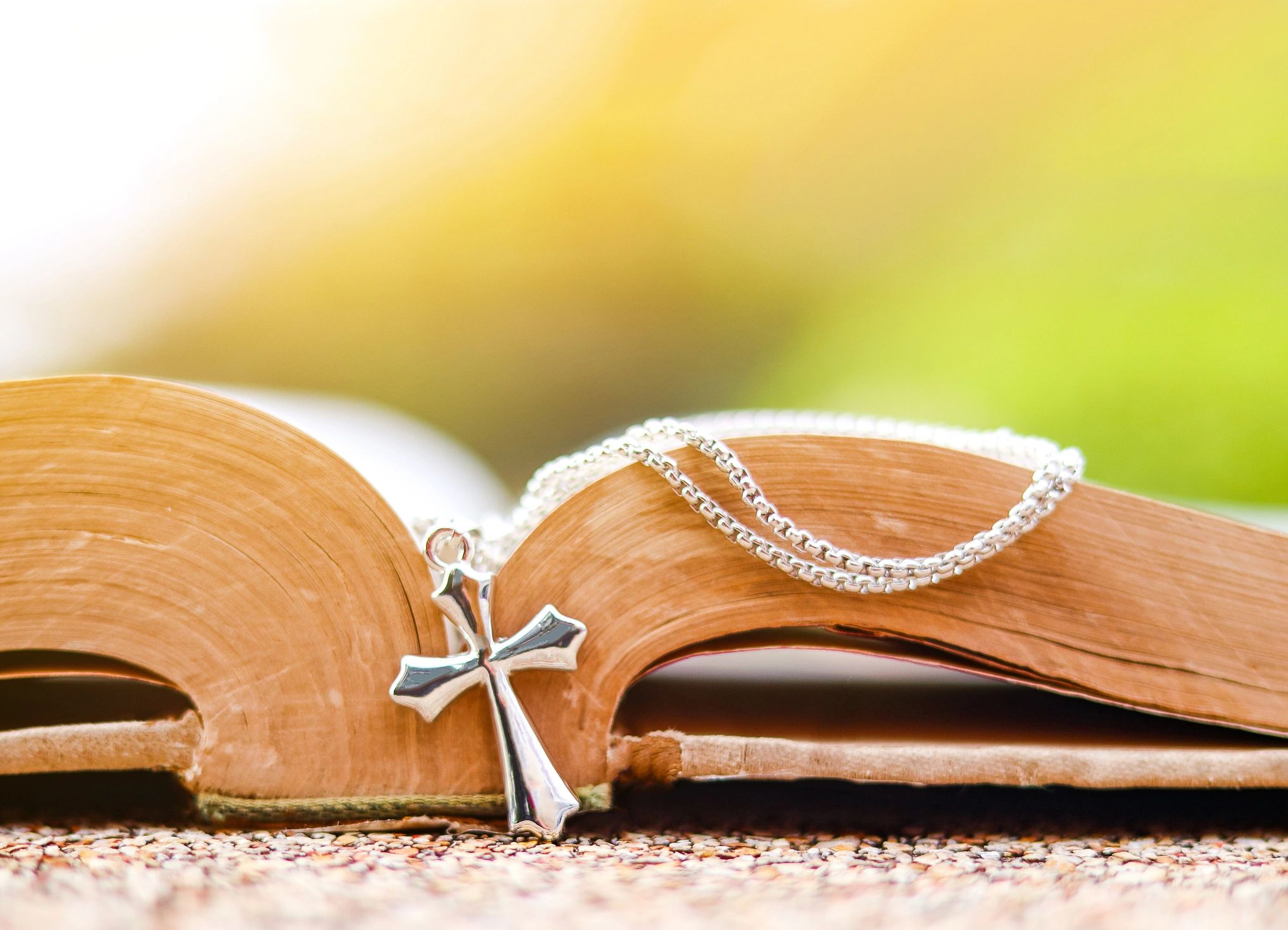 Open Bible with cross for scripture study