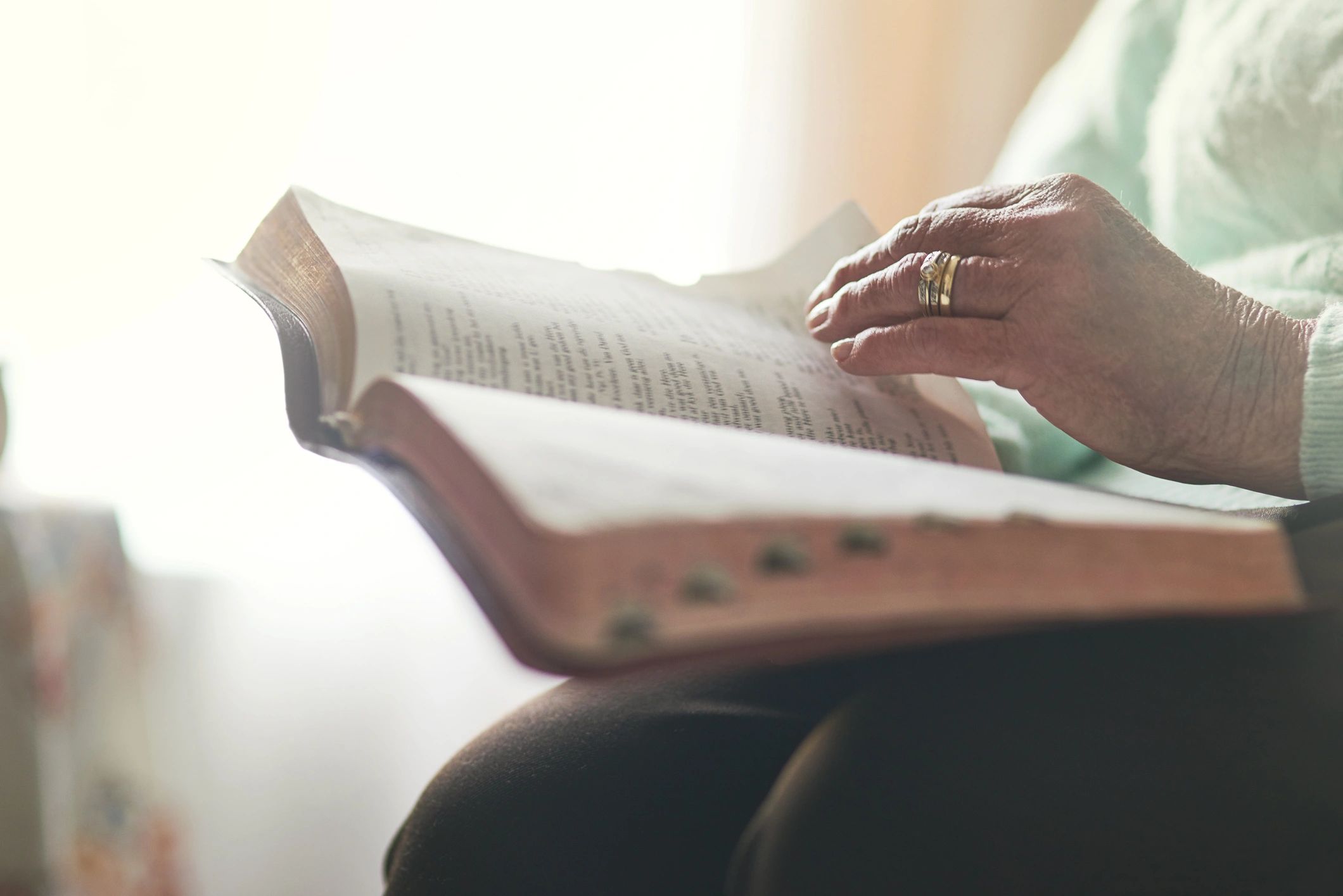 Woman reading a Bible in quiet reflection