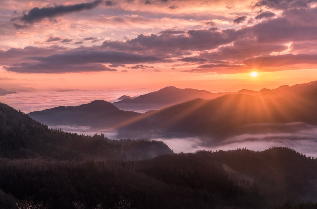 A peaceful sunrise over hills representing hope and emotional healing