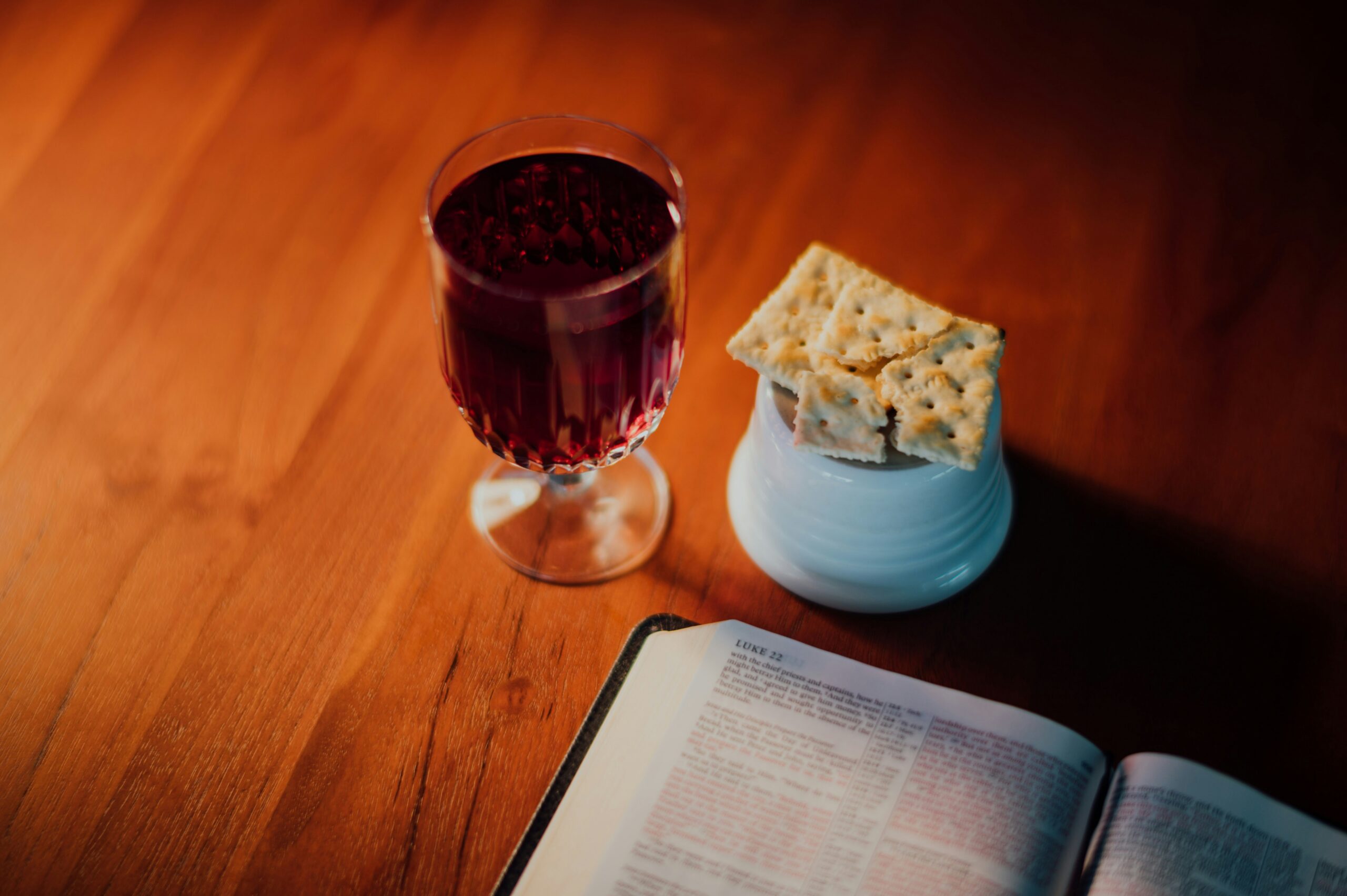 Holy Communion with bread and cup on a reverent table, representing remembrance of Jesus Christ